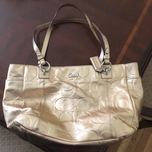 Gold colored Coach purse